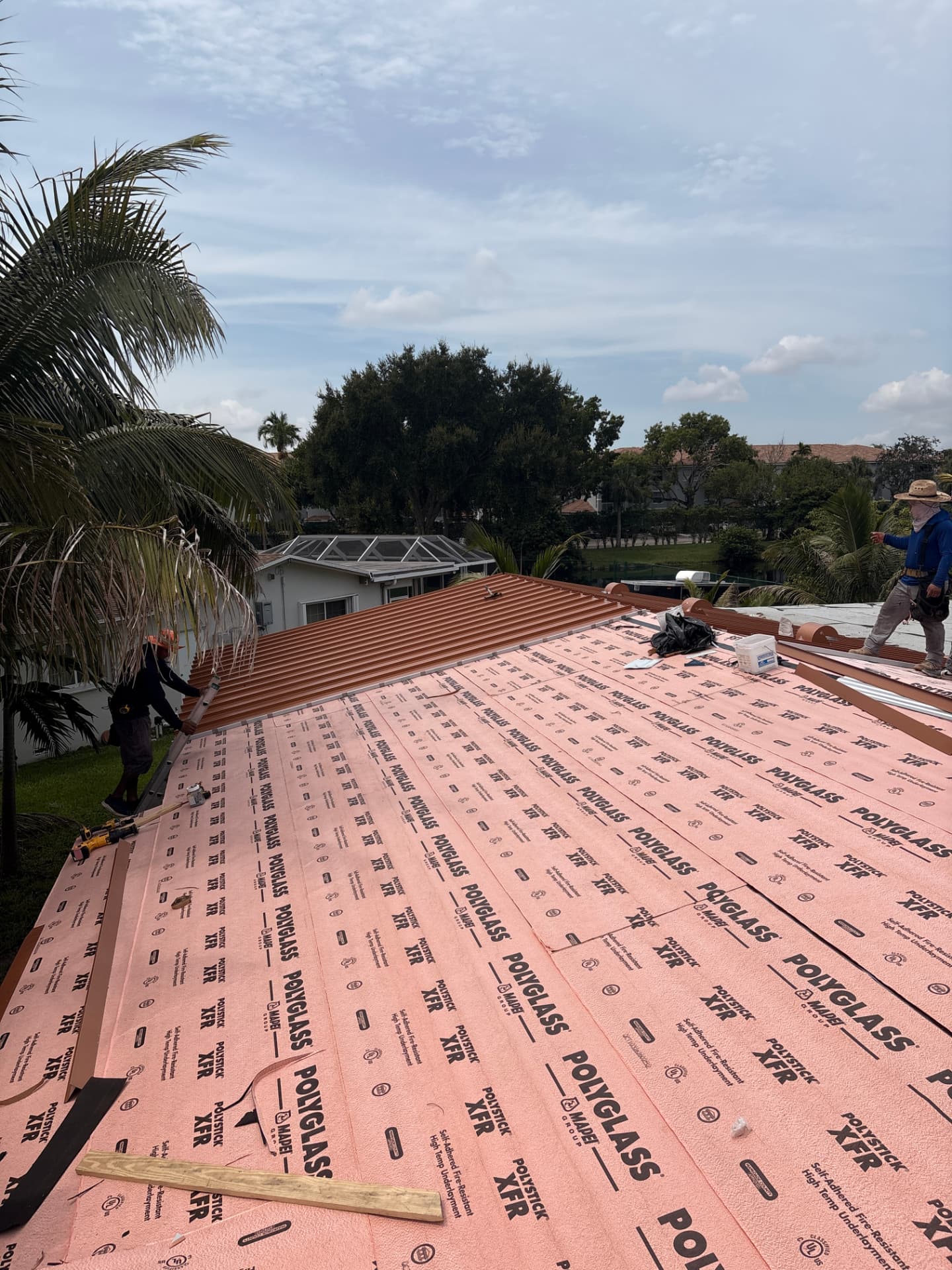 Advanced Tech & All Repair Kings crew installing a new metal roof
